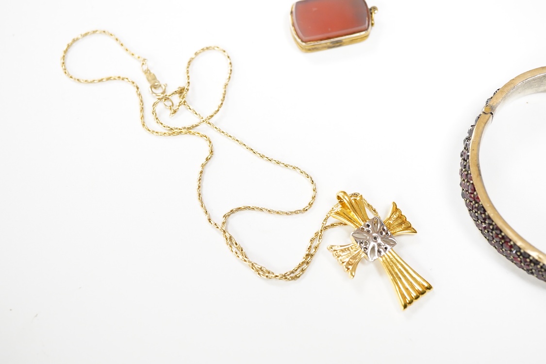 An 800 standard gilt white metal and garnet cluster set oval pendant, 18mm, on a 585 yellow metal fine link chain, 2.5 grams, a gilt white metal and garnet cluster set hinged bangle, two white metal brooches including on